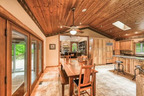 a dining room with a wooden table and chairs at Windswept Cove in Bumpass