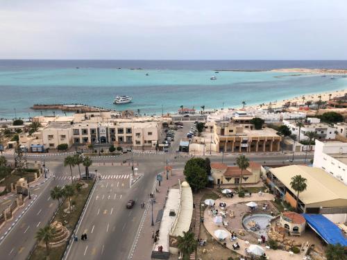 a view of a city with a beach and the ocean at شقه فندقيه مطله على البحر in Marsa Matruh
