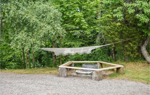 a table with a hammock on top of it at 7 Bedroom Awesome Home In Örkelljunga in Orkelljunga