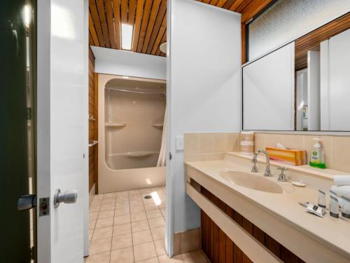 a bathroom with a sink and a toilet at Nautical Owl 122 Nautilus Beach Resort in Coffs Harbour