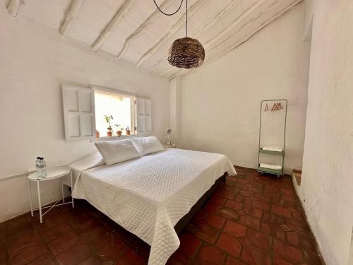 Ένα ή περισσότερα κρεβάτια σε δωμάτιο στο Casa Sua