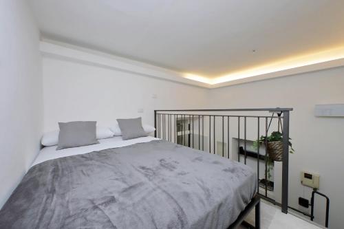 a bedroom with a large bed and a balcony at Katia Charme in Rome