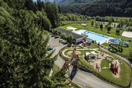 an aerial view of a resort with a pool at Landhaus Waldesruh in Oetz