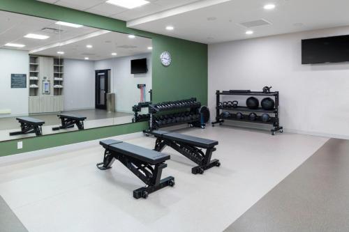 a gym with benches and a ping pong table at Fairfield by Marriott Inn & Suites Buckeye Verrado in Buckeye