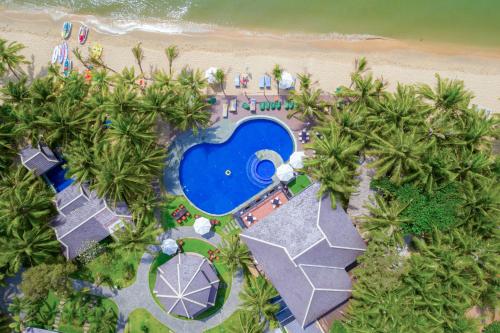 an overhead view of a resort with a swimming pool and a beach at Anja Beach Resort & Spa in Phu Quoc