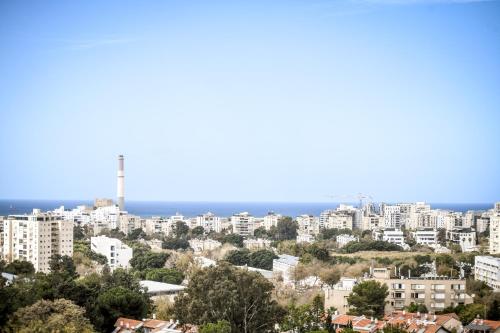 a cityscape of a city with buildings at דירות גני תערוכה - TLV university apartments near Expo by Sea N' Rent in Tel Aviv