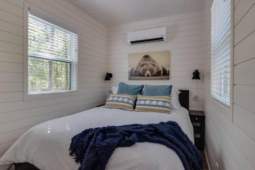 a bedroom with a bed with a blue blanket at Deer Woods in Broken Bow