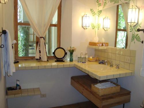 a bathroom with a sink and a mirror at Casa Mision de San Miguel in San Miguel de Allende