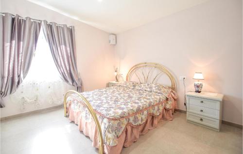a bedroom with a bed and a window at 2 Bedroom Stunning Home In Camaiore in Camaiore