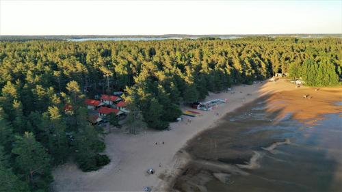 an aerial view of a beach with trees at Karlstad Swecamp Bomstadbaden in Karlstad
