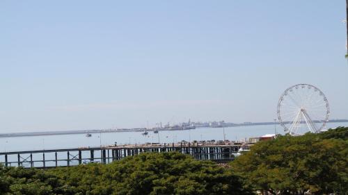a ferris wheel on a pier next to the water at Darwin Waterfront Short Stay Apartments in Darwin