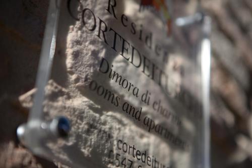 a close up of a sign with street names at Relais B&B Corte Dei Turchi in Longiano