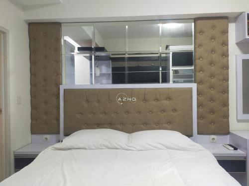 Tempat tidur dalam kamar di Airin Suite