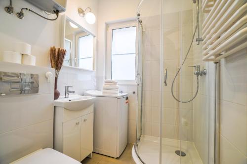 a bathroom with a shower and a toilet and a sink at CITYSTAY Old Town Gdansk Apartment in Gdańsk