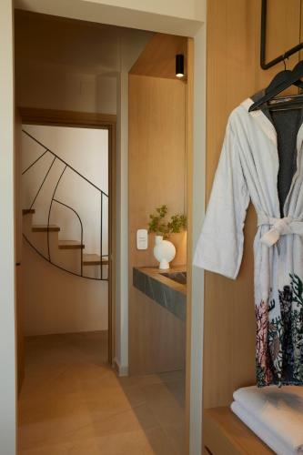 a room with a hallway with a mirror and a door at Epiphany Villas Lefkada in Tsoukaladhes