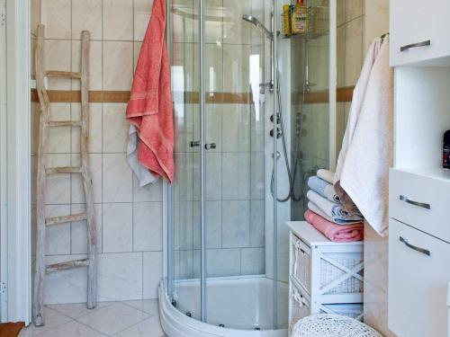 a bathroom with a shower and a ladder at Apartment Frederikstad II in Fredrikstad