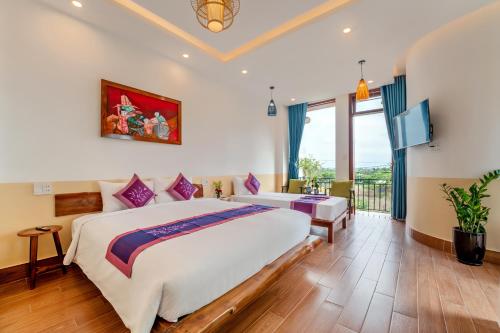 Ένα ή περισσότερα κρεβάτια σε δωμάτιο στο An Bang Chic Villa Nguyên Căn