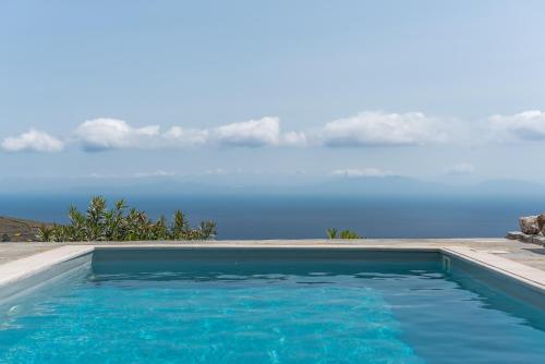 a swimming pool with a view of the water at Flaias Gi Villa Retreat in Agia Mavra