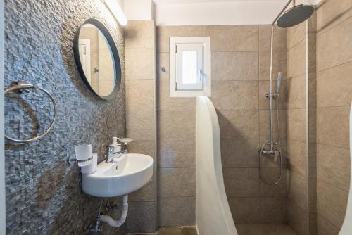 a bathroom with a sink and a shower at Flaias Gi Villa Retreat in Agia Mavra