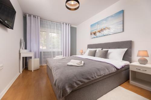 a bedroom with a large bed and a window at Apartment in Silo/Insel Krk 13445 in Šilo