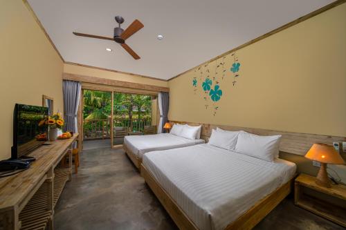 Postel nebo postele na pokoji v ubytování Lahana Resort Phu Quoc & Spa