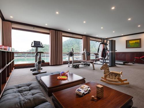 a living room with a couch and a gym at Aqua Of The Seas Cruise Halong in Ha Long