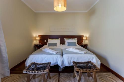 מיטה או מיטות בחדר ב-480 Liberdade Apartamento