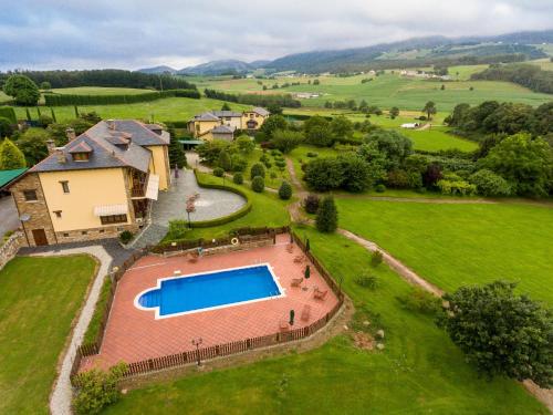 an aerial view of an estate with a swimming pool at Hotel Hacienda Llamabua in Navia