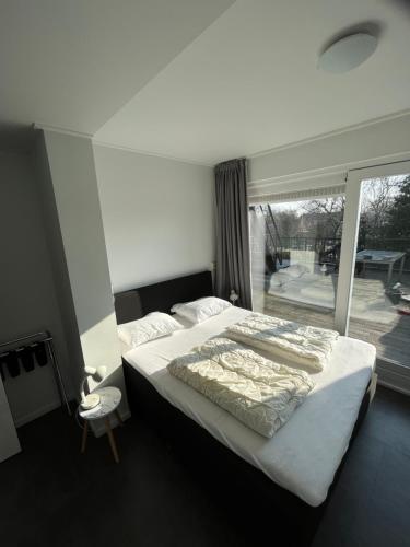 เตียงในห้องที่ Residence het Centrum