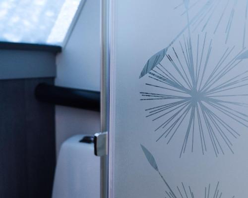 a door with a star design on the side of it at Arctic SnowHotel & Glass Igloos in Sinettä