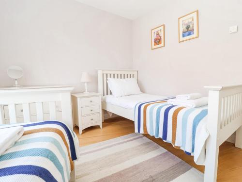 Ein Bett oder Betten in einem Zimmer der Unterkunft 23 Tibby's Way
