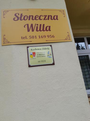 a sign on a wall that reads strecanza willka at Słoneczna Willa & sauny Apartamenty in Kudowa-Zdrój