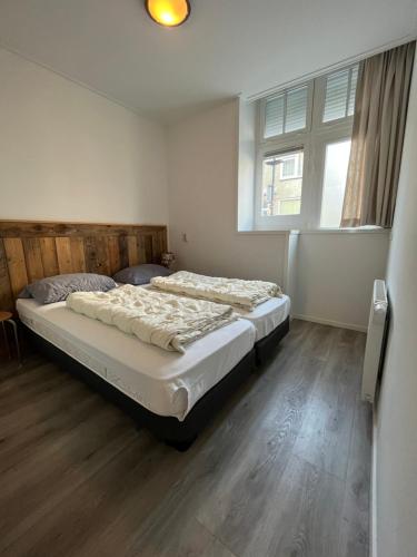 Giường trong phòng chung tại Residence het Centrum