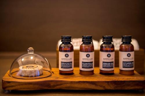 three bottles of honey next to a glass jar at Suiun in Hakone