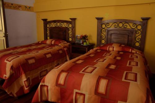 Letto o letti in una camera di Hostal Mallqui