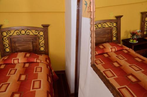 Letto o letti in una camera di Hostal Mallqui