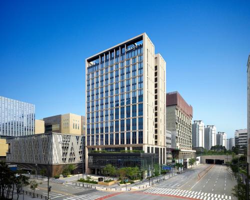 a tall building in a city with a street at GRAVITY Seoul Pangyo, Autograph Collection in Seongnam