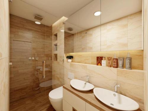 a bathroom with two sinks and a toilet and a shower at Apartments Villa Subic in Rab