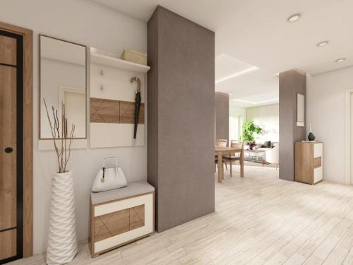 a living room with a hallway with a table at Apartments Villa Subic in Rab