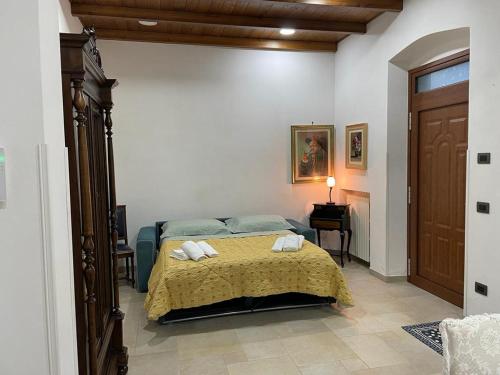 Ένα ή περισσότερα κρεβάτια σε δωμάτιο στο Sasha House Casa Vacanze