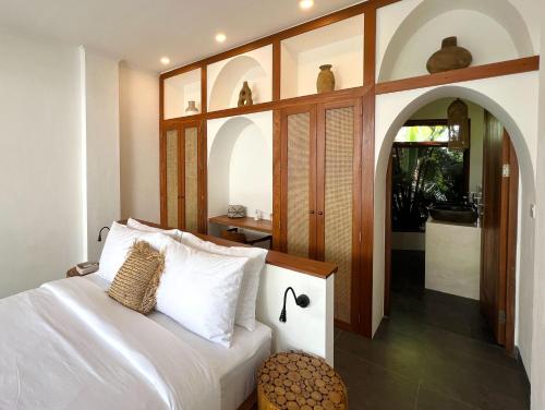 Ένα ή περισσότερα κρεβάτια σε δωμάτιο στο Casa Carolina Bali