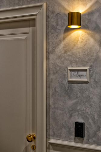 a light on a wall next to a door at Ancona e Riviera Luxury b&b in Ancona