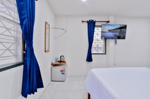 Postel nebo postele na pokoji v ubytování GP House Krabi Aonang Beach