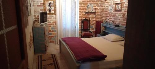 Ένα ή περισσότερα κρεβάτια σε δωμάτιο στο Arti Vila