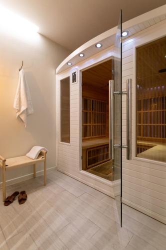 a bathroom with a walk in shower and a glass shower stall at Villas les Capucines in Sète