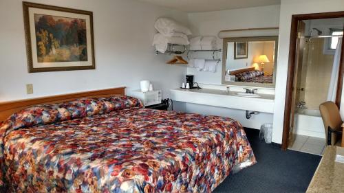 Postel nebo postele na pokoji v ubytování A Wyoming Inn