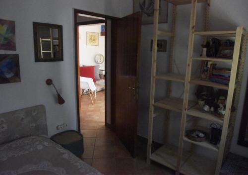 a room with a living room with a couch and a room with a room at Τhe banana tree beach house in Marathón