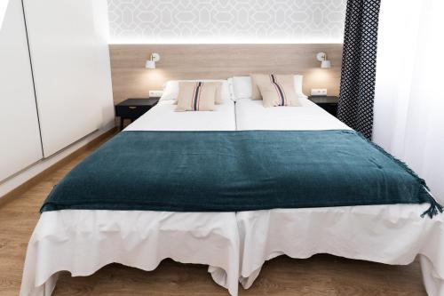 Кровать или кровати в номере ALOJAMIENTOS LOS PEDROCHES