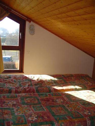 A bed or beds in a room at Les Chalets Du Pres D'amont