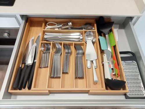 a drawer filled with utensils in a kitchen at SEAFRONT APARTMENT PINEDA BEACH in La Pineda